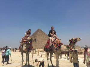 Maryann's Daughter Taylor & granddaughter on one camel and Son in Law Jake & grandson on another in Egypt.